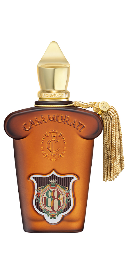 casamorati-nobilis-group-packshots-880x440-b1 - BERGERAT | WE MAKE BEAUTY PERFORM Casamorati perfume bottle in amber glass with gold cap and crest emblem, hanging tassel on the side