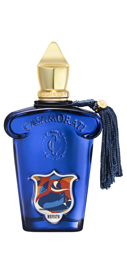 casamorati-nobilis-group-packshots-880x440-b3 - BERGERAT | WE MAKE BEAUTY PERFORM Blue glass perfume bottle with a gold cap and navy tassel reading Casamorati, decorative crest on front, bottle labeled Mefisto.
