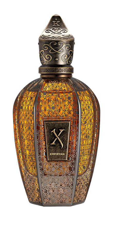 xerjoff-nobilis-group-packshots-880x440-EMPIRYAN - BERGERAT | WE MAKE BEAUTY PERFORM Xerjoff Empyrian perfume bottle with bronze lattice and ornate metal cap, amber-toned glass.